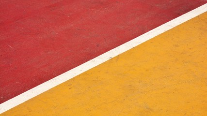 Fototapeta premium closeup red and yellow basketball court