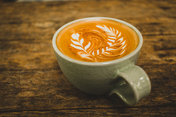 cup of coffee on wooden table