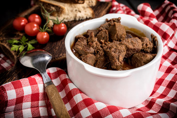 Beef meat stew in ceramic pot.