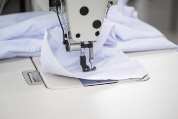 sewing machine and shirt sleeve, close-up