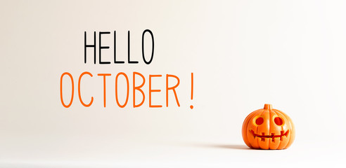 Hello October with small orange pumpkin lantern