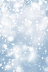 Blue Christmas  background with frosty snowflakes and   glittering bokeh stars. Abstract  Glowing...