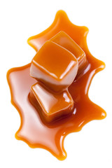 Sweet Caramel candies with caramel topping  sauce isolated on a white background close up.