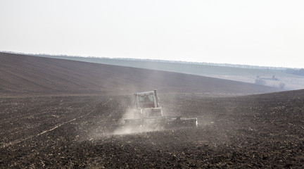 Harrowing the soil with disc harrows