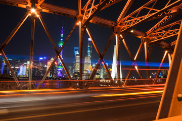 Fototapeta na wymiar Shanghai, China - December 25 2017: Shanghai Skyline at night - long exposure - bridge looking at tv oriental building