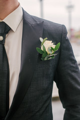 groom with a bouquet of flowers
