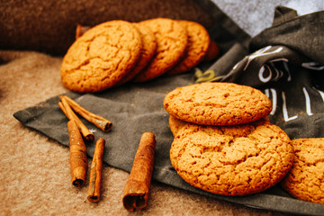 New Year and Christmas. Serpentine and garlands. Ginger and oatmeal cookies. New Year sweets.Brown...
