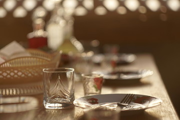 Glasses and plates on table - food background 