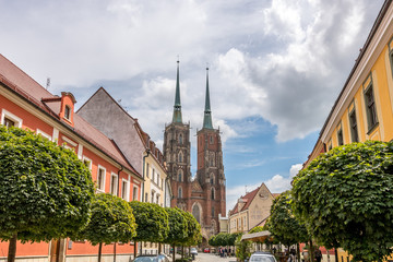 Street in Wrocław with amazing sky and clouds and church