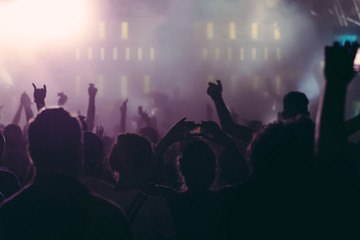 Crowd at a concert with hands up
