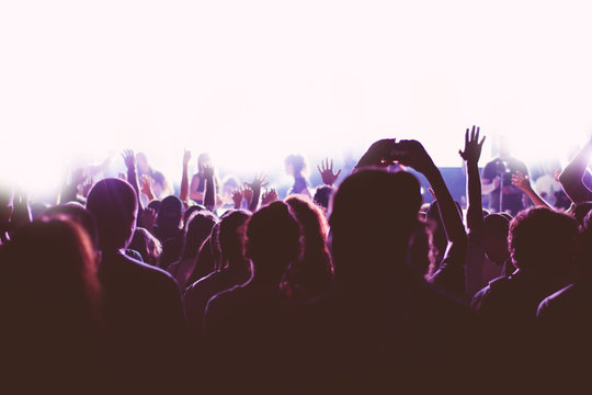 Crowd at a concert with hands up