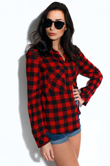 Brunette model, fashion model on a white background, model in a plaid shirt