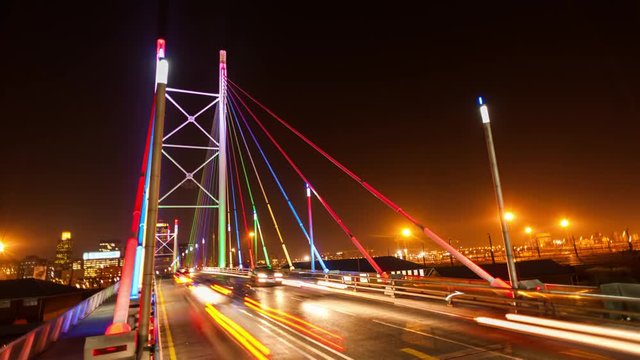 Loop of Static timelapse at night shooting down on the Nelson Mandela Bridge in the city centre of Johannesburg, South Africa during peak traffic time