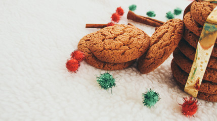 New Year and Christmas. Serpentine and garlands. Ginger and oatmeal cookies. New Year sweets. White background.