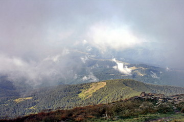 Clouds and fog over mountains. The Carpathian Mountains. Montenegrin Range. The national biosphere reserve of Hoverla.
