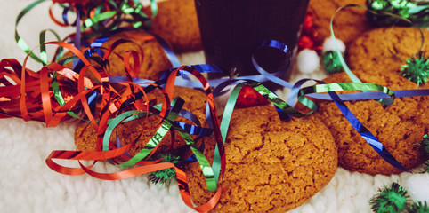 New Year and Christmas. Serpentine and garlands. Ginger and oatmeal cookies. New Year sweets. White...