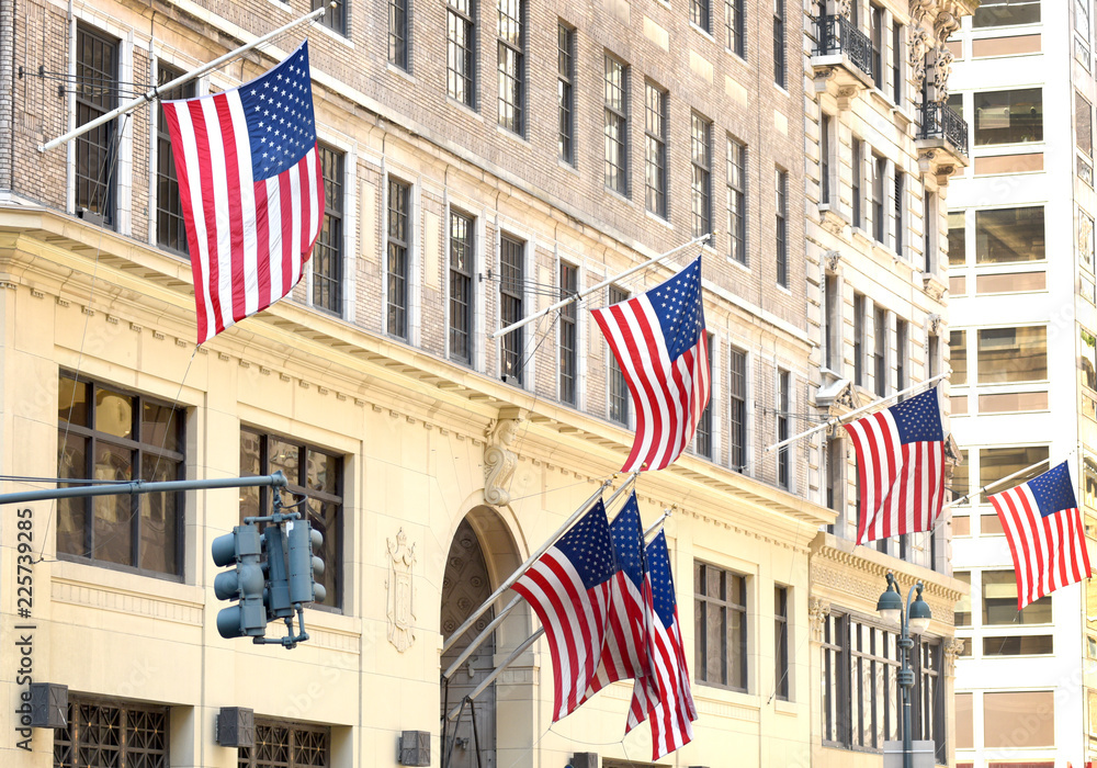 Wall mural us flags on a building in new york, usa