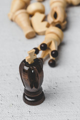 Game and chess pieces on white background