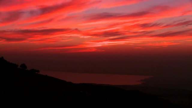 Loop of A beautiful time lapse sunset behind the Dead Sea in Jordan suggests the Holy land. Loop 1 of 2.