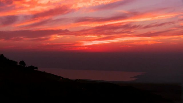 Loop of A beautiful time lapse sunset behind the Dead Sea in Jordan suggests the Holy land. Loop 2 of 2.
