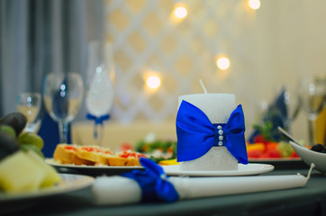 The restaurant is decorated with wedding decor, Banquet hall . The table of the bride and groom . bottle decorated with hand work