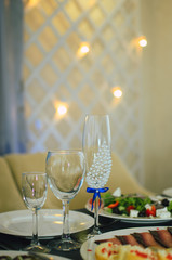 The restaurant is decorated with wedding decor, Banquet hall . The table of the bride and groom