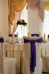 The restaurant is decorated with wedding decor, Banquet hall . The table of the bride and groom