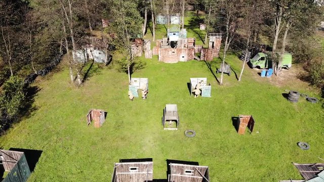 Aerial view of paintball game. Beginning of the round, players take positions on fire line