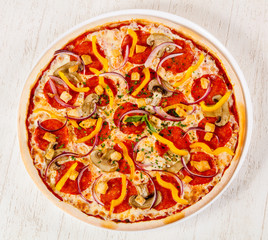 Pizza with salami and mushrooms