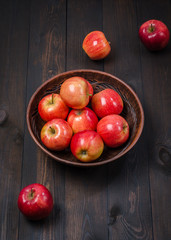 Red apples on a dark rustic background