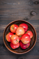Red apples on a dark rustic background