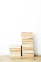 Pile of books on white background. Minimal reading concept.
