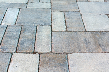 Street tiled stone pavement as bacground. perspective distortion effect
