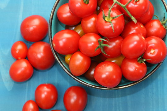 Red tomatoes in a bowl.