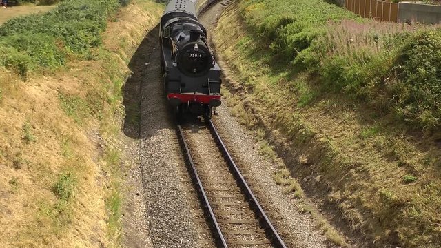 Steam Train Pulling Passenger Carriages