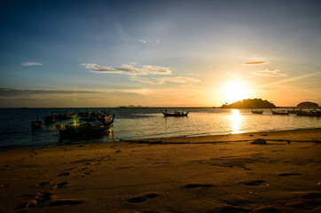 Sunrise with boats in a beach, Koh Lipe, Thailand