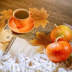 Autumn background with yellow maple leaves, black coffee and pumpkins. Layout for seasonal offers and holiday cards, top view. Golden October. SALE BLACK FRIDAY. Selective focus.