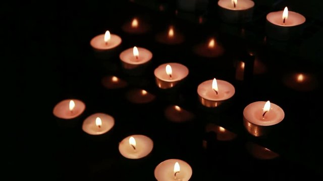 Loop of Candles at an alter being blown out