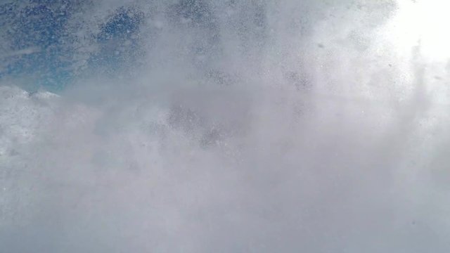 Loop of Happy snowboarder having fun riding powder snow off piste in snowy mountains