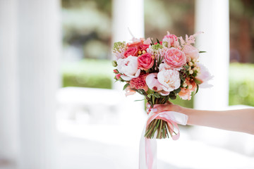 Flower bouquet in woman hand