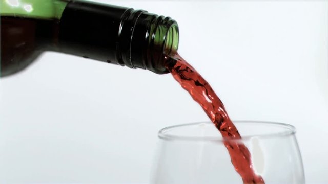 Loop of Red wine being poured in super slow motion