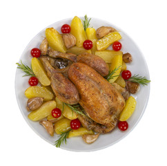 Roast chicken and various vegetables on a white plate