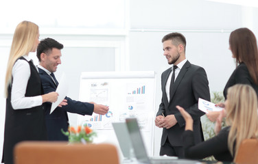 businessman makes a presentation to his business team