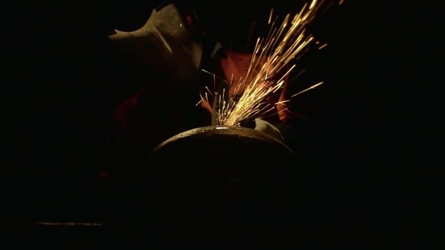 Cutting A Metal Disc In Front Human