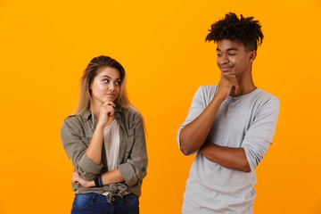 Portrait of a smiling pensive multiethnic couple