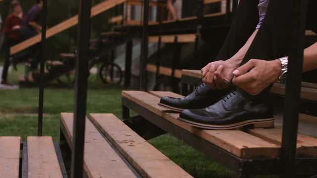 Men wearing work black boot. on the stairs outdoor