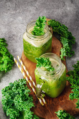 Two jars of green kale smoothie above