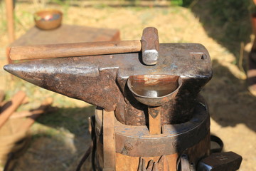 old rusty anvil and hammer