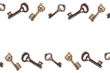 White background with a frame of vintage keys