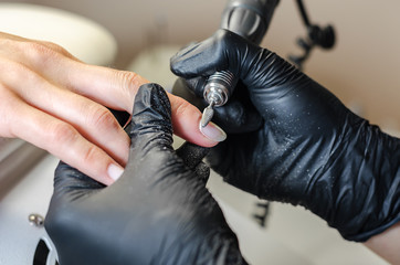 The master does hardware manicure.